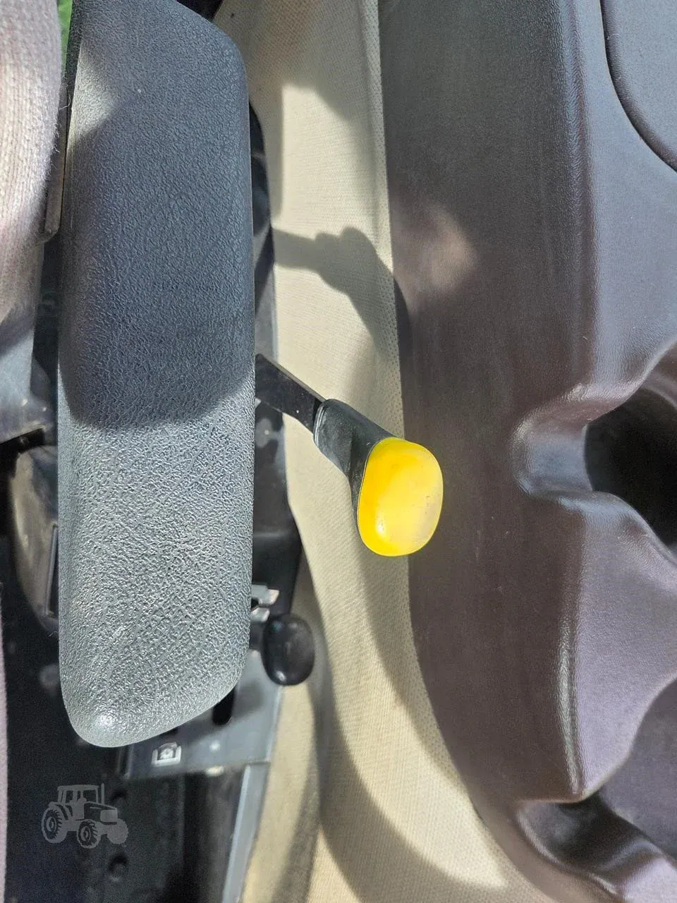 img (23) John Deere 5101E tractor gear shift lever with yellow knob.