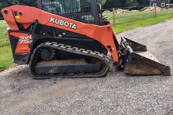 2020 Kubota SVL75-2 compact track loader with bucket attachment on gravel surface.
