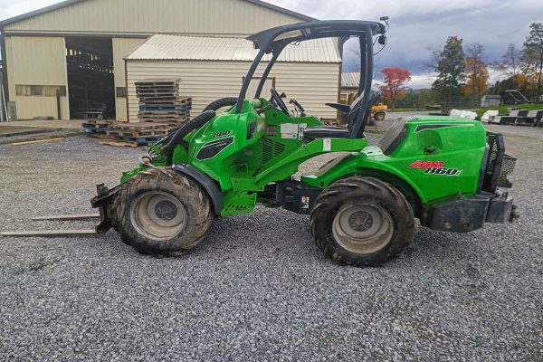 Green 2022 AVANT 860i compact loader with cab and large tires.