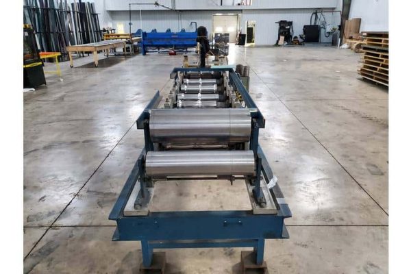 Heavy-duty industrial roller conveyor system in a spacious warehouse setting.