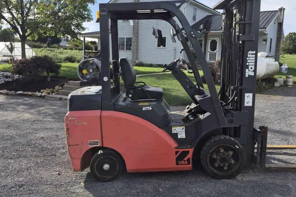 Tailift forklift with 4,300-lb capacity, black and red, in outdoor setting.