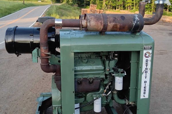 Green industrial power unit with exhaust pipe and filters, used for heavy machinery.