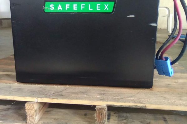Lithium SafeFlex battery with black casing and wiring for electric machinery.