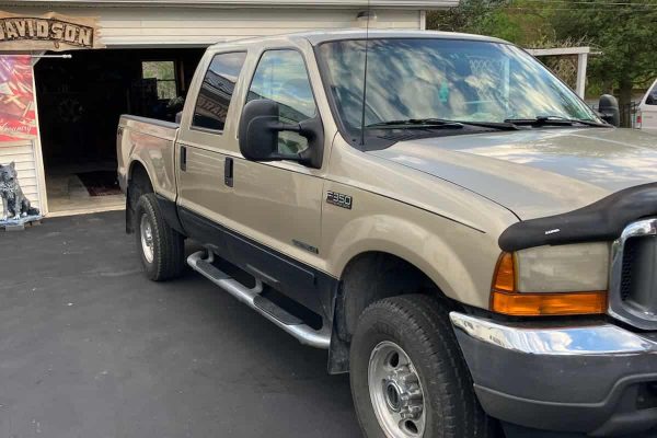 2008 Ford F-250 Super Duty pickup truck with extended cab and dual rear wheels.