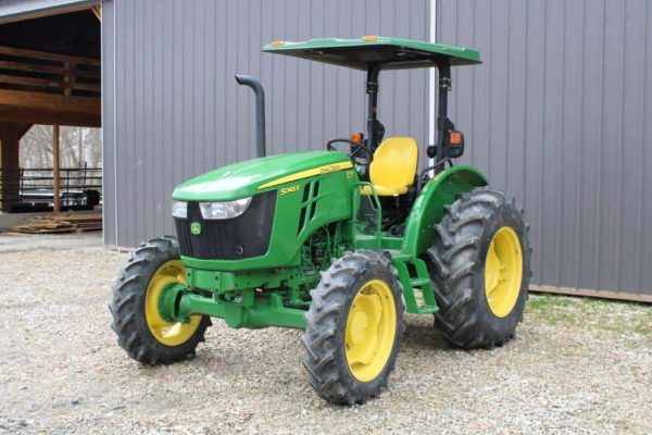 Green John Deere 5055E tractor with yellow wheels, 2020 model, outdoor setting.