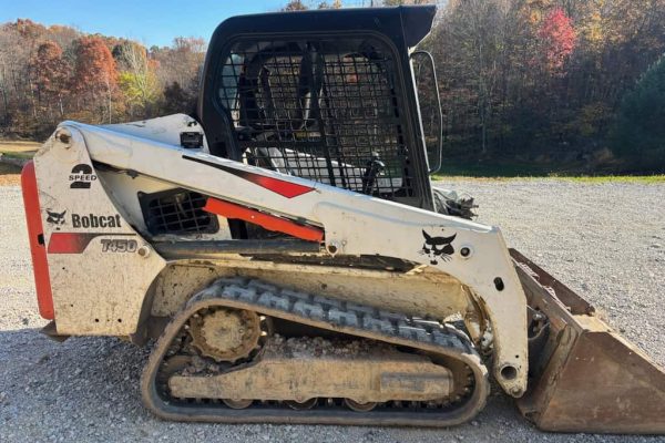 2017 Bobcat T450 compact track loader with bucket and enclosed cab.