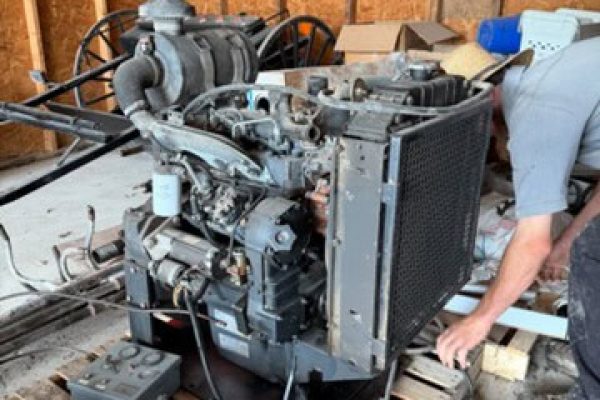 Iveco diesel power unit with radiator and engine components on a wooden pallet.