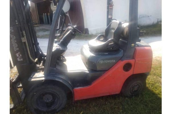Red Toyota forklift from 2020 with black tires and operator seat, ideal for warehouse material handling.