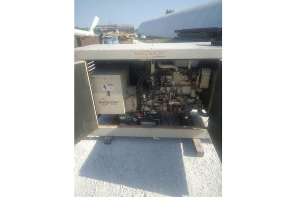 Industrial generator engine with visible components, no specific make or model identified.