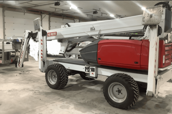 2022 DINO 92RXTE boom lift with extended arm and cab, in a warehouse setting.