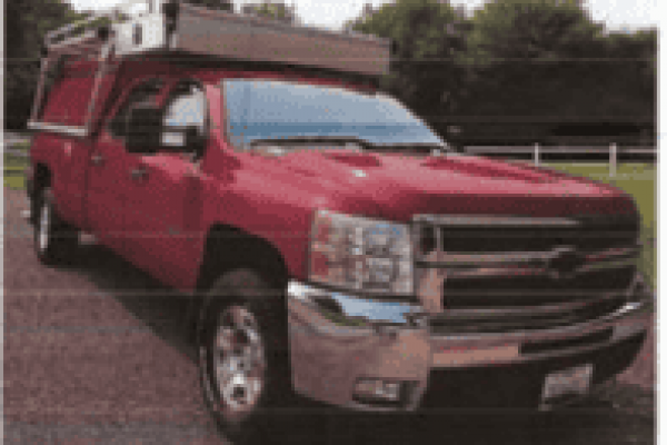2009 Chevrolet Silverado pickup truck with extended cab and chrome accents.