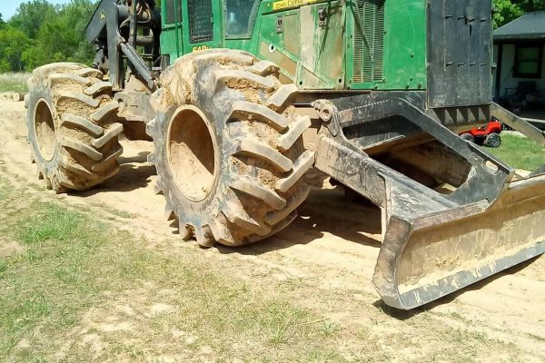 Green John Deere 644K Wheel Loader with large tires and front bucket attachment.