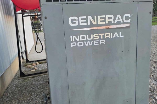 Generac 50 KW propane industrial generator with vented top and gray metal enclosure.
