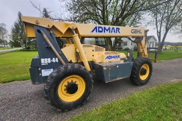 Heavy-duty ADMAR GEHL R56-44 telehandler forklift with yellow and black exterior, suitable for construction and industrial ta.